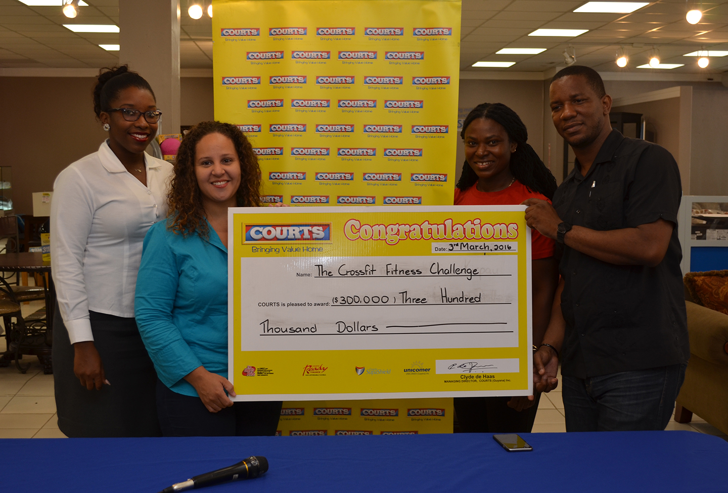 Courts Guyana Inc on board E-Networks Cross Fitness Challenge