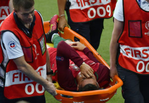 Cristiano Ronaldo of Portugal shows his emotion while being taken off by a stretcher during the UEFA EURO 2016 Final match between Portugal and France at Stade de France on July 10, 2016 in Paris, France.  (Photo by Dan Mullan/Getty Images)