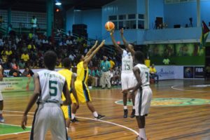Guyana's Kevon Wiggins shoots one from beyond the arc during the CBC U16 Championship finals.