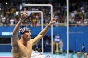 Michael Phelps celebrates another gold medal performance