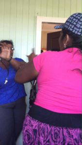 Photo of Vendor and overseer engaged in scuffle