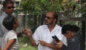 Dr. Bheri Ramsaran and Sherline Nageer (backing camera) on the day in question