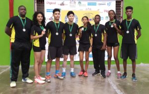 Members of the Guyana team display their silver medals