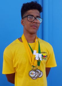 Hannibal Gaskin proudly displays his six medals- four golds and two silvers