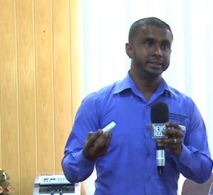 Mr. Rampersaud explaining how the lubricant is used