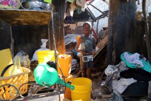“We heard on the radio that a storm was coming. My father also told me, but I was very scared when the roof fell over our heads,” says Renelson. “And now the radio doesn’t work any longer.” Photo: UNICEF