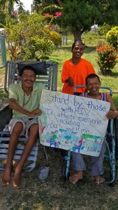 Residents of the Cheshire Home (Region 4) for persons with disabilities displaying their poster Official
