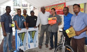 Winners of the media promotion pose with their prizes