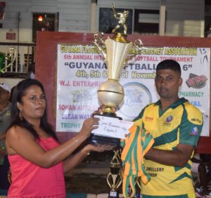 Regal All-Stars skipper Fazal Rafeek collects the runner-up trophy and cash incentive