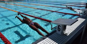 North Georgetown's Jamaal Skeete explodes of the blocks during his 100 metres backstroke win
