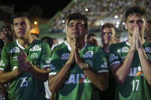 Heartbreaking pictures show the moment footballers broke down in tears as they gathered with family and fans to remember teammates wiped out in a devastating plane crash in Colombia (Daily Mail photo)