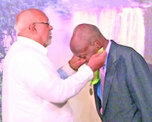 E.R. Braithwaite receiving the CCH, Guyana's third highest national award, from Former President, Donald Ramotar on Aug 23, 2012