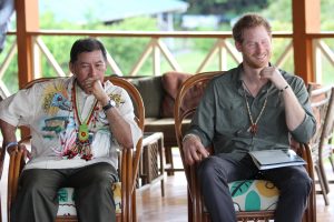 Prince Harry is all smiles as he sits next to Vice President and Minister of Indigenous Peoples Affairs, Sydney Allicock