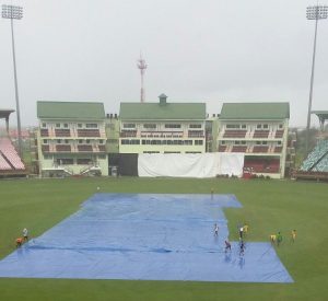 Groundstaff covering the pitches in the midst of a downpour the Guyana Jaguars/Trinidad and Tobago Red Force game
