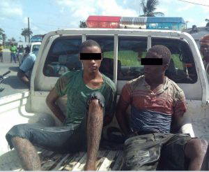 The suspects being taken away by the police