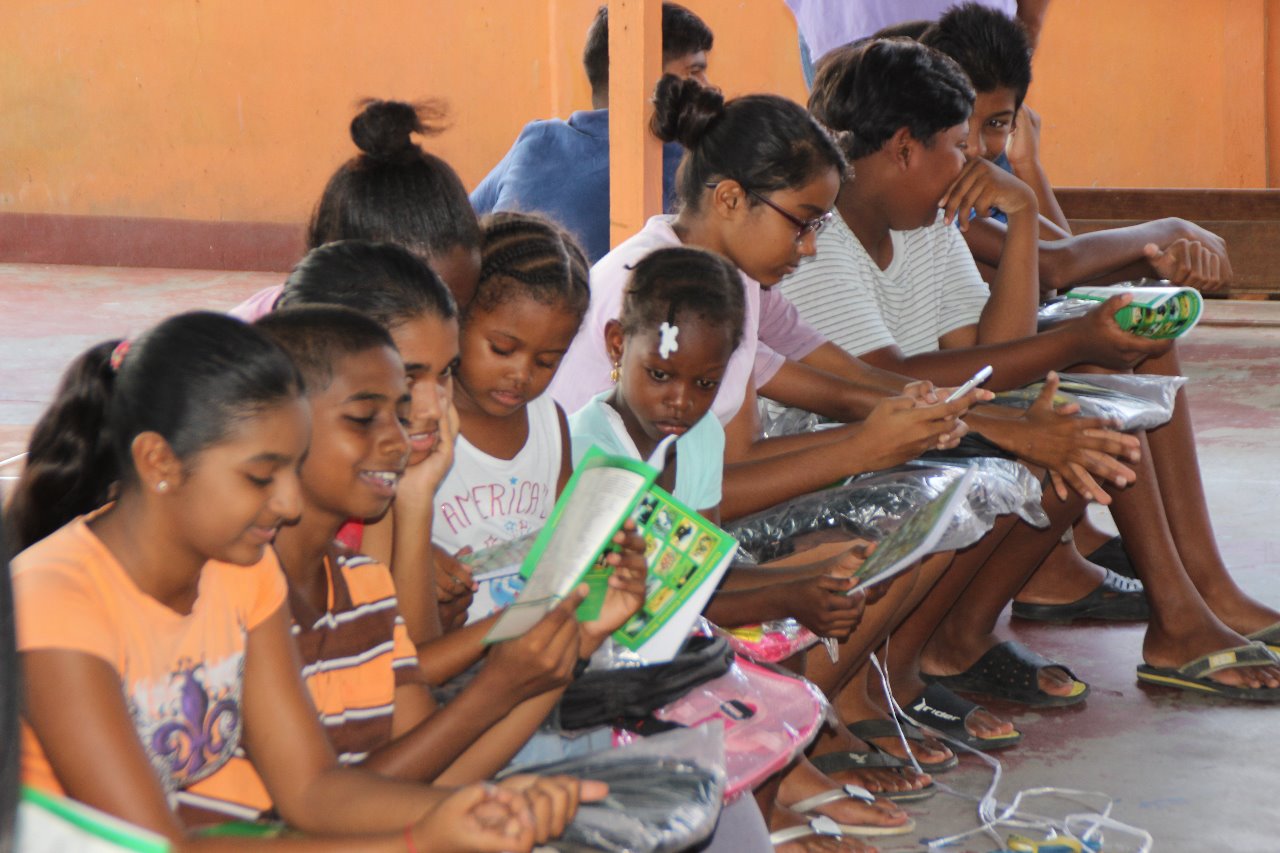 Students receive school supplies from Minister Broomes