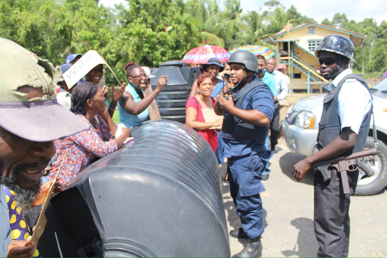 Berbice residents protest for water, prevents Govt Minister, other officials from traversing